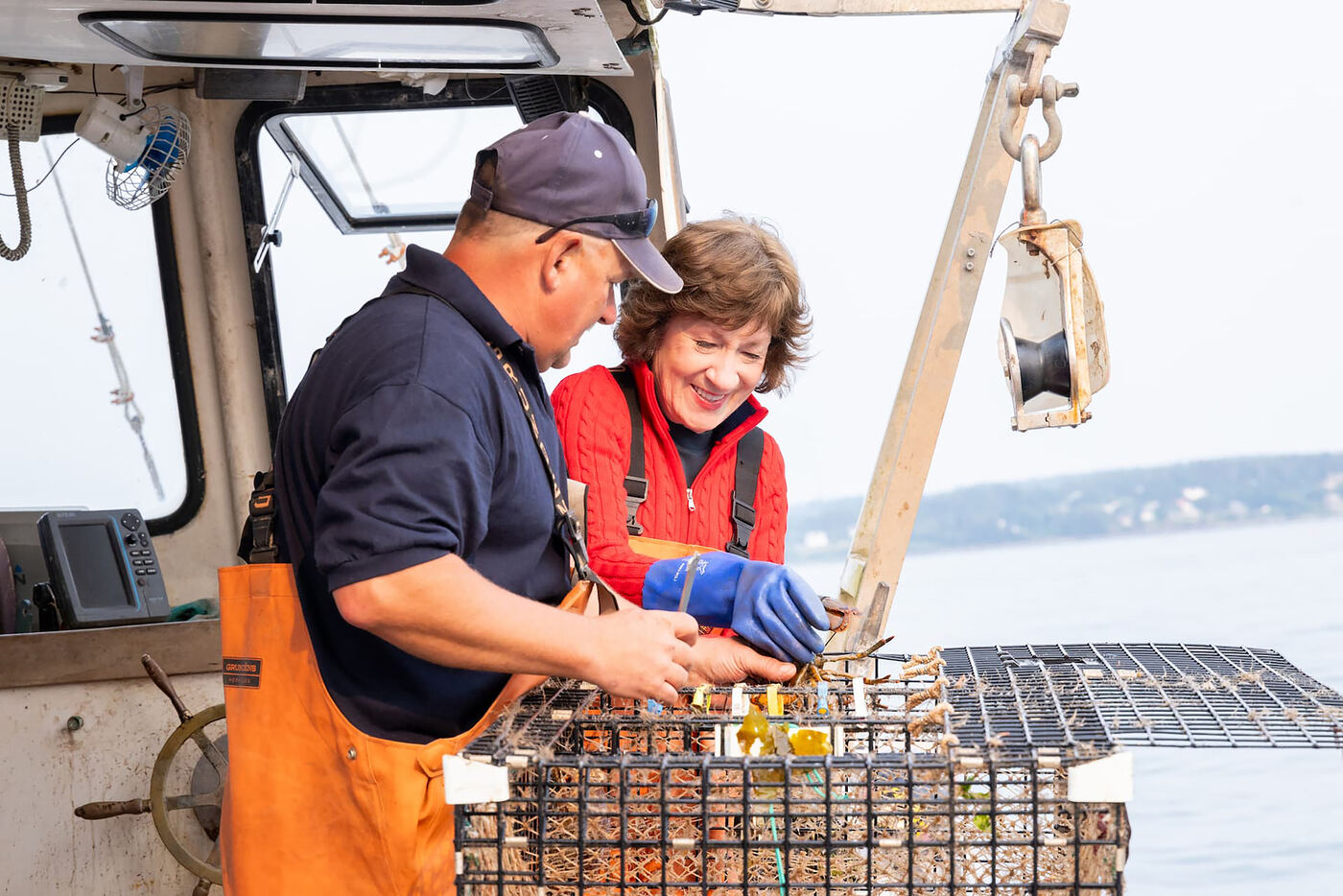 Senator Collins with a Maine lobsterman on his boat